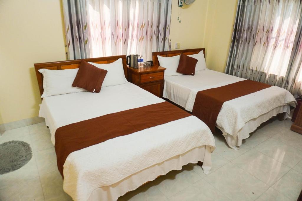 Postel nebo postele na pokoji v ubytování Phong Nha Orient Homestay