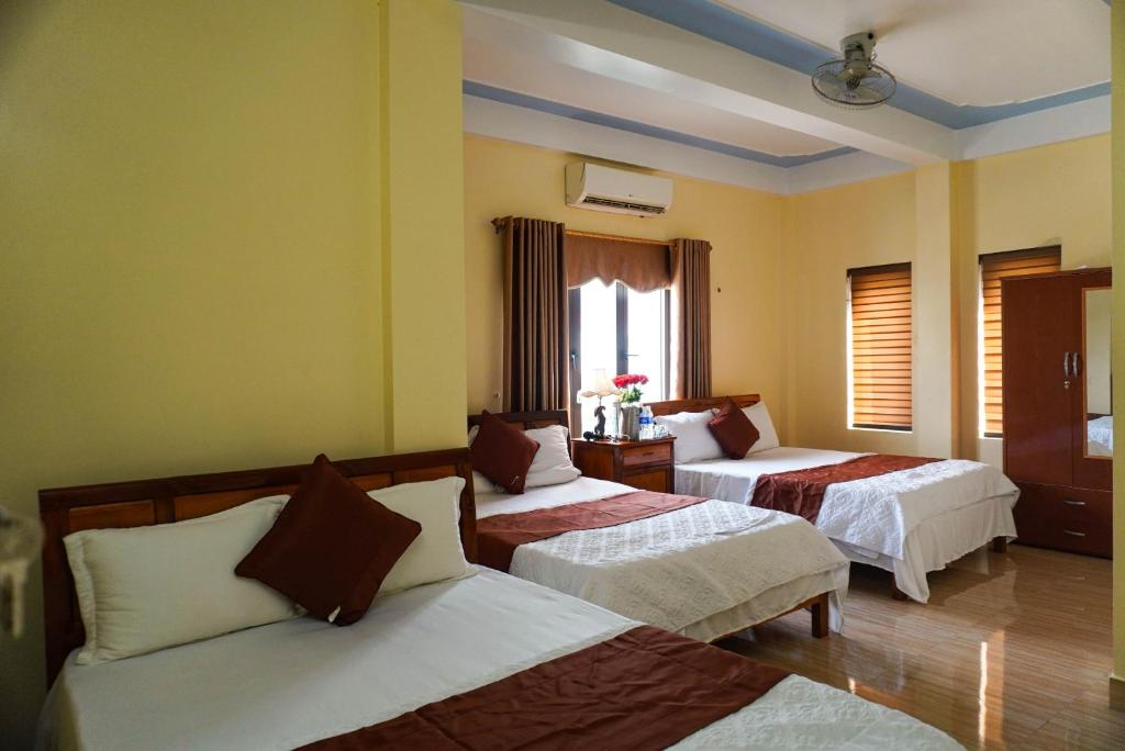 Postel nebo postele na pokoji v ubytování Phong Nha Orient Homestay