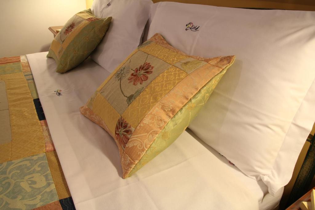 Postel nebo postele na pokoji v ubytování B&B Liolà