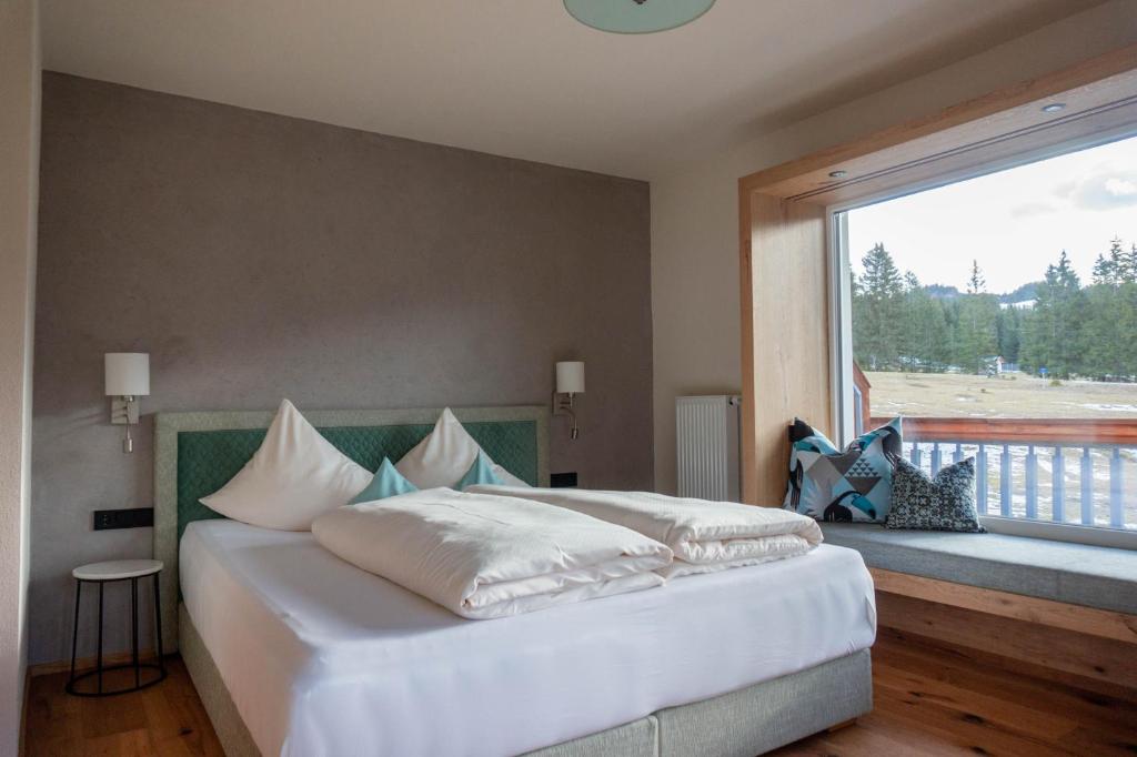 Postel nebo postele na pokoji v ubytování Hotel Lumberger Hof