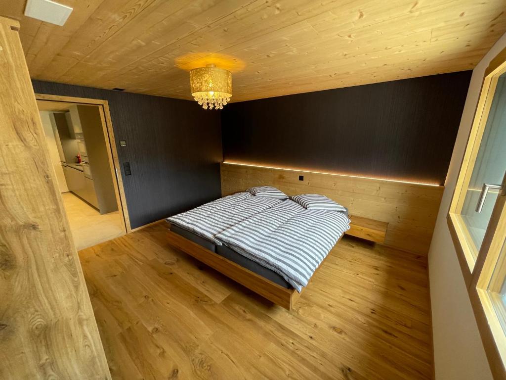 Postel nebo postele na pokoji v ubytování Bergblick Apartments - Weisshorn