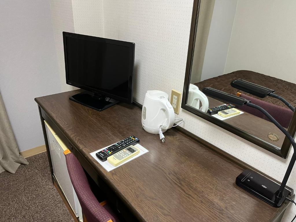 TV a/nebo společenská místnost v ubytování Nakamura Daiichi Hotel