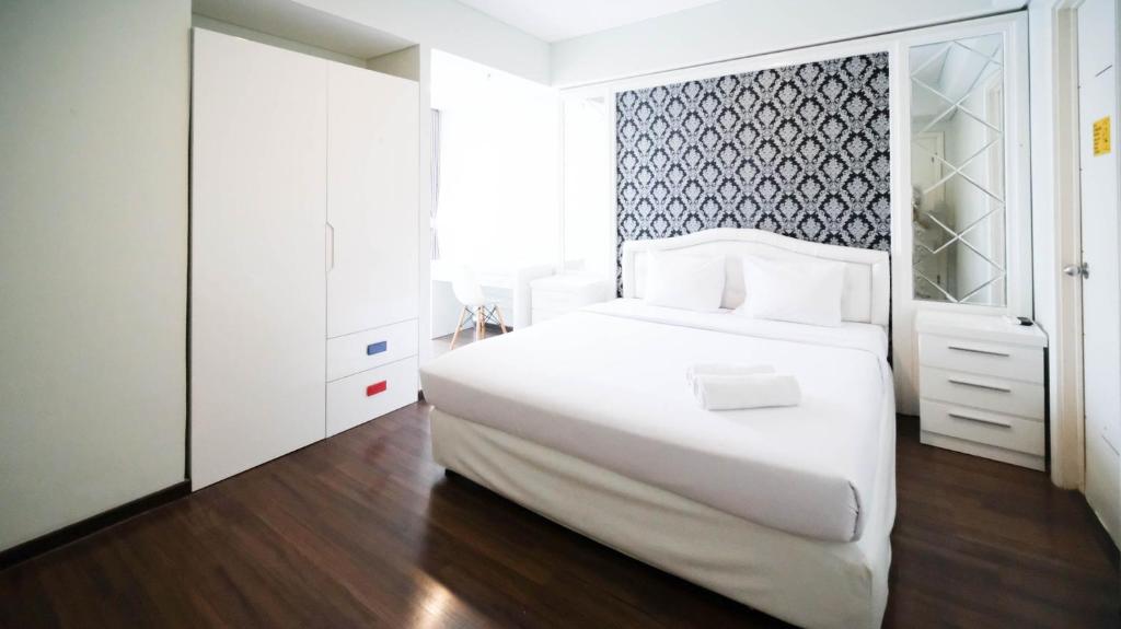 Postel nebo postele na pokoji v ubytování Strategic and Spacious 2BR Apartment at Trillium Residence By Travelio