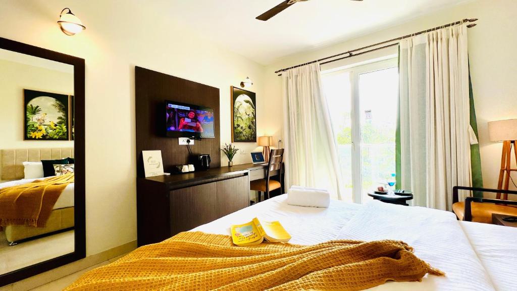 Letto o letti in una camera di BluO Amani Vagator - Boutique Hotel Goa