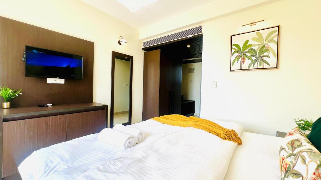 Letto o letti in una camera di BluO Amani Vagator - Boutique Hotel Goa