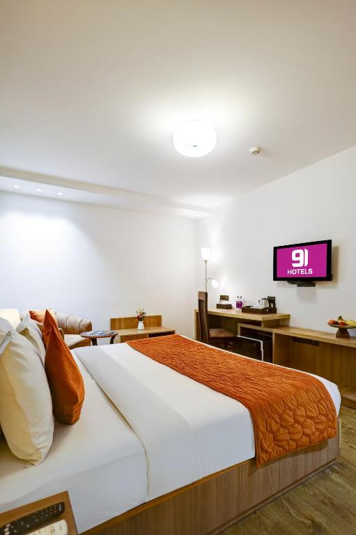 Postel nebo postele na pokoji v ubytování Hotel 91 Huda City Centre