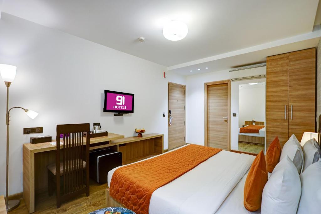 TV a/nebo společenská místnost v ubytování Hotel 91 Huda City Centre