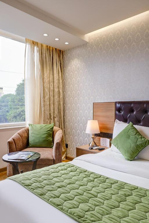 Postel nebo postele na pokoji v ubytování Hotel 91 Huda City Centre