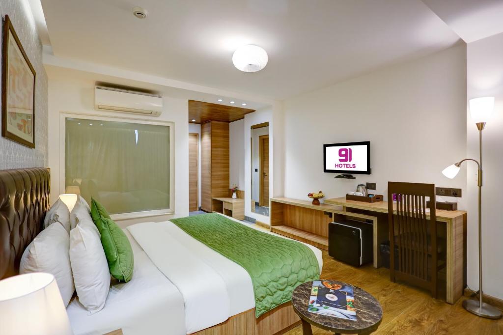 TV a/nebo společenská místnost v ubytování Hotel 91 Huda City Centre