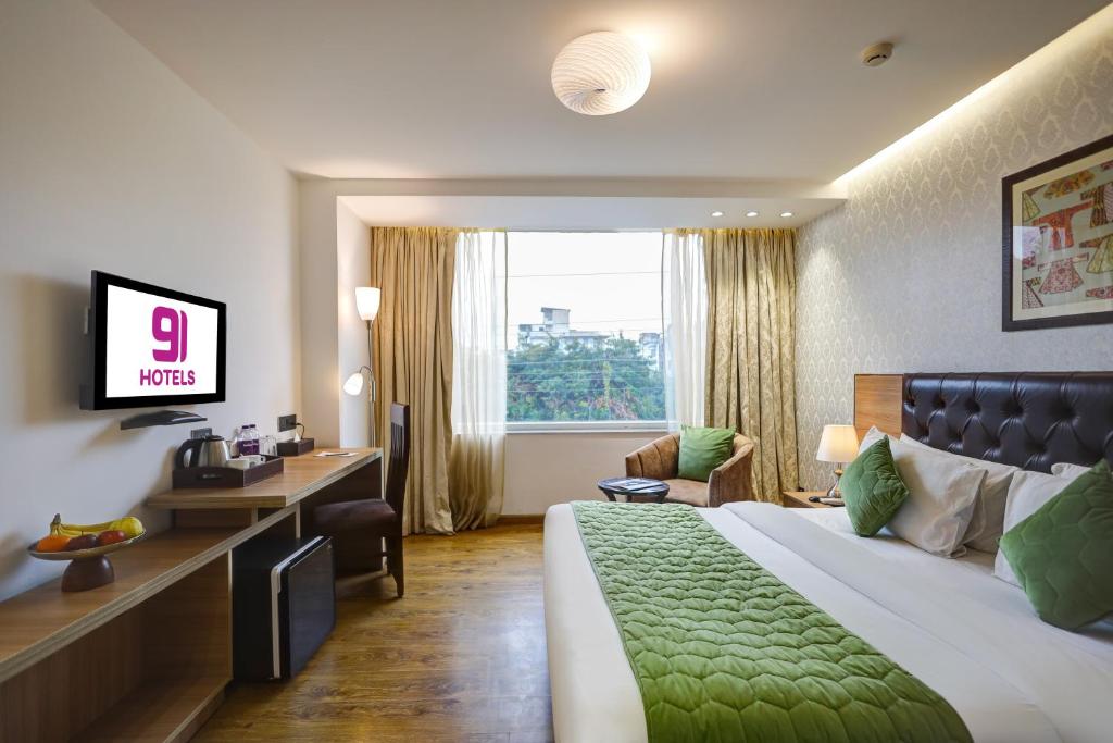 TV a/nebo společenská místnost v ubytování Hotel 91 Huda City Centre