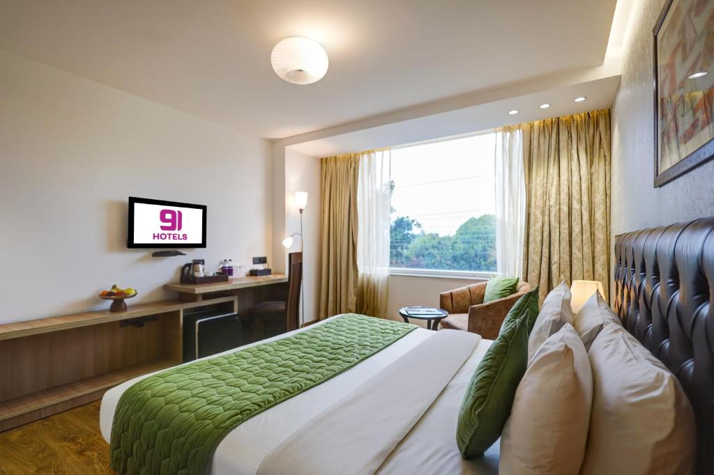TV a/nebo společenská místnost v ubytování Hotel 91 Huda City Centre
