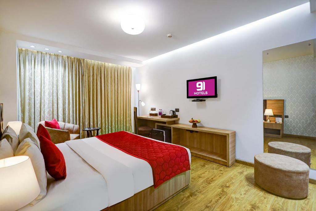 Postel nebo postele na pokoji v ubytování Hotel 91 Huda City Centre