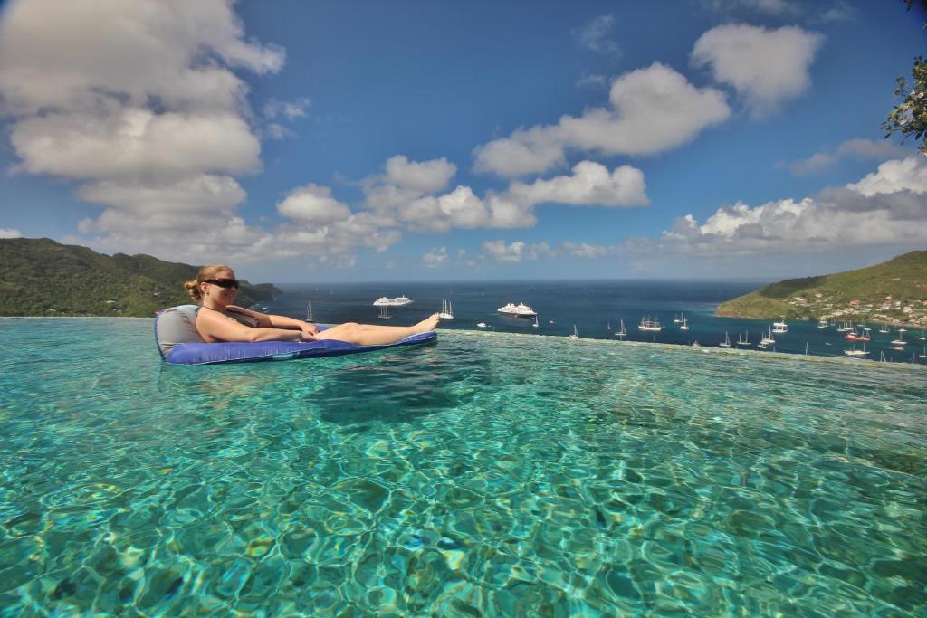 a woman sitting on a raft in the water at Tropical Hideaway in Port Elizabeth