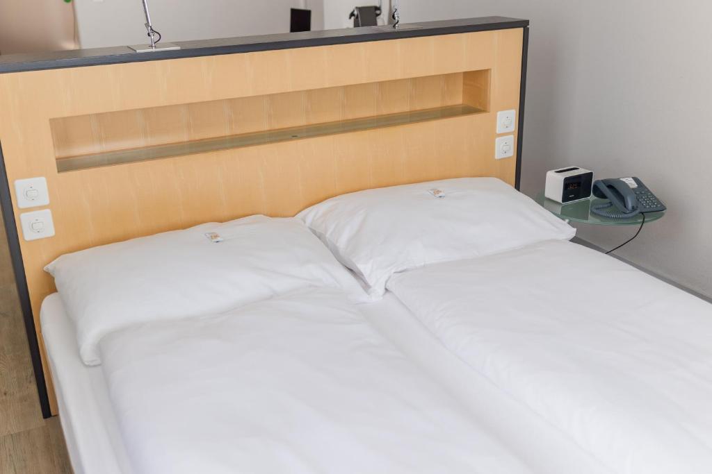 Llit o llits en una habitació de Royal Hotel - Urban Living