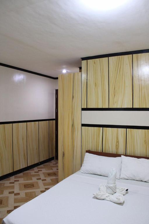 Postel nebo postele na pokoji v ubytování Agustin El Nido Inn