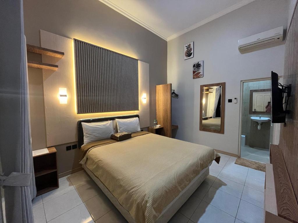Postel nebo postele na pokoji v ubytování Clover Homestay