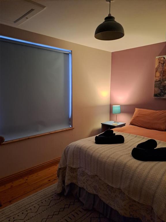 Postel nebo postele na pokoji v ubytování Helnoweth Lodge