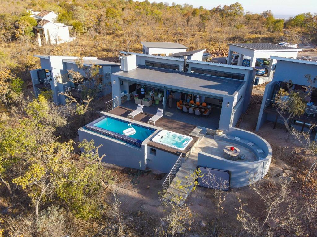 an aerial view of a house with a swimming pool at La-Ngwenya Serenite in Warmbaths