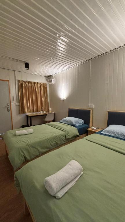 Postel nebo postele na pokoji v ubytování 5 Minutes Lodge