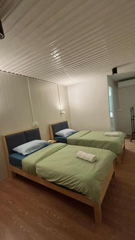Postel nebo postele na pokoji v ubytování 5 Minutes Lodge
