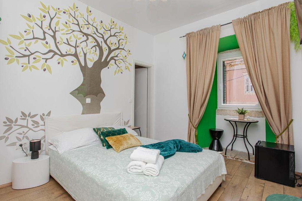 Postel nebo postele na pokoji v ubytování Guesthouse Mimbelli