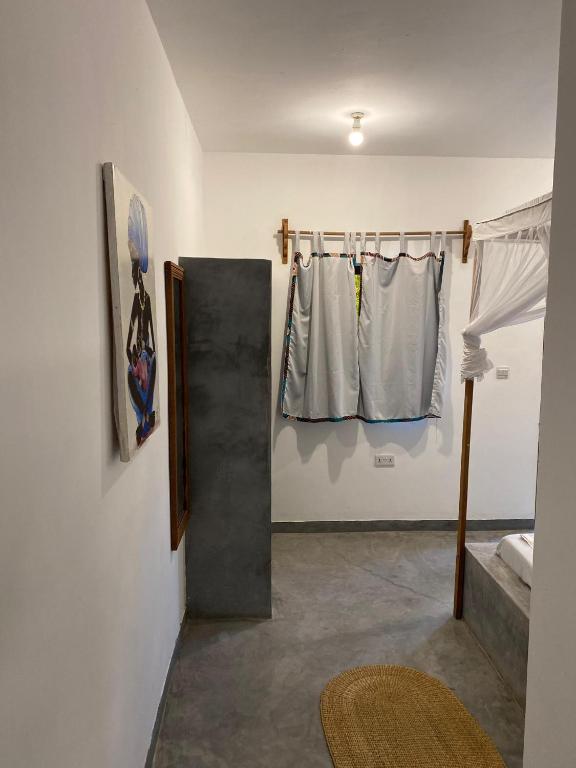 Postel nebo postele na pokoji v ubytování Shamba Village