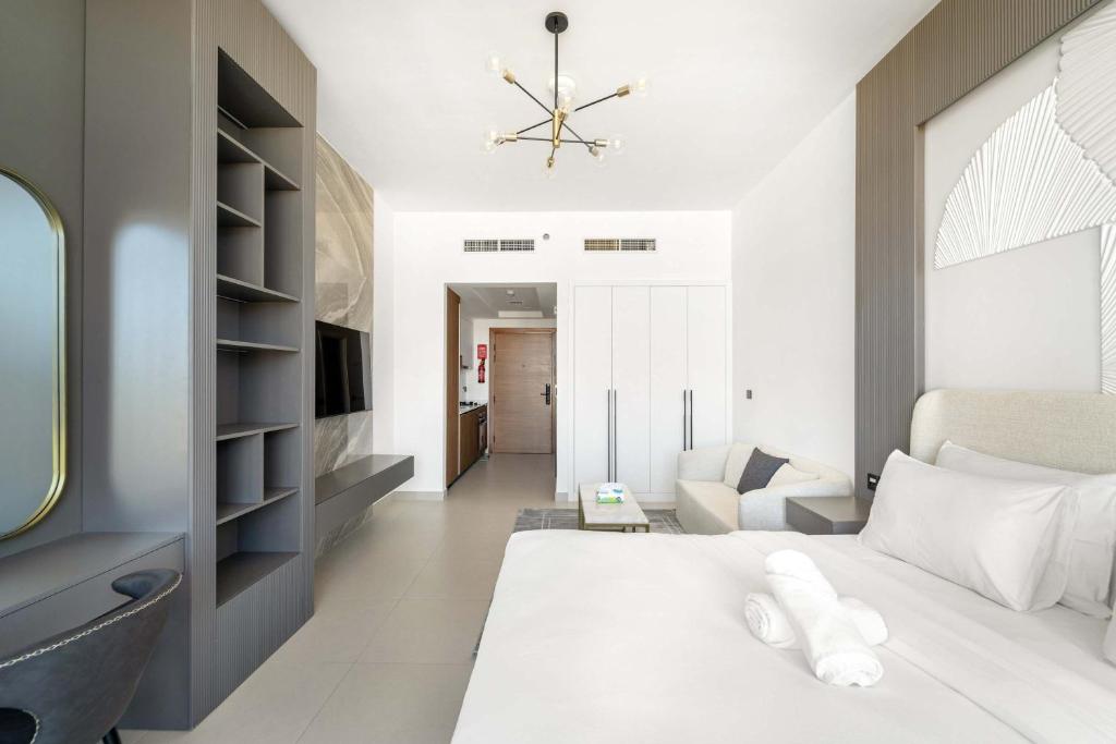 Katil atau katil-katil dalam bilik di Charming new studio with pool and gym in Al Furjan