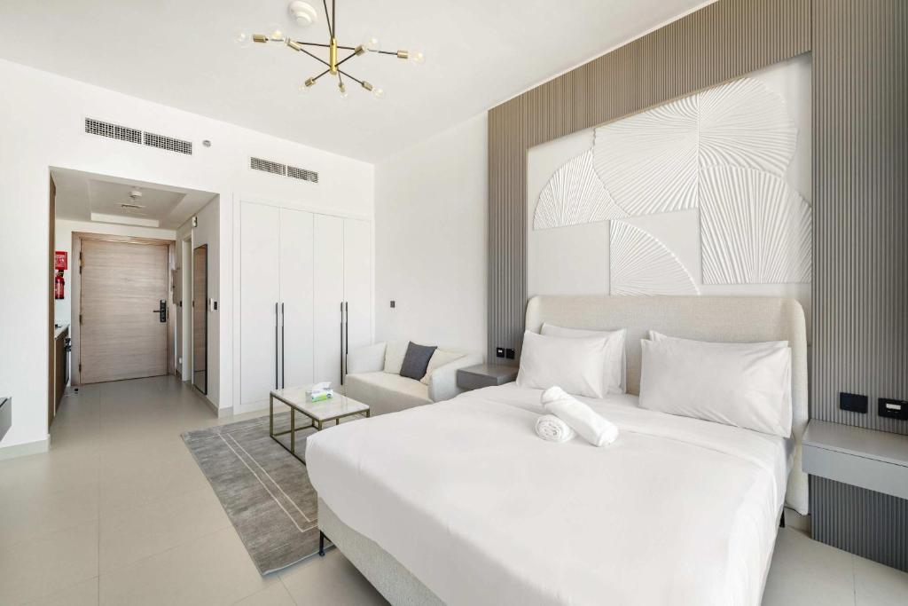 Katil atau katil-katil dalam bilik di Charming new studio with pool and gym in Al Furjan