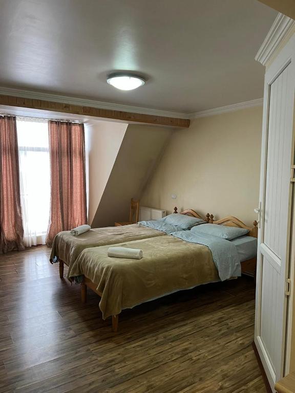 Postel nebo postele na pokoji v ubytování Mestiatour Guest House