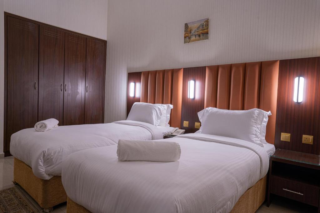 Postel nebo postele na pokoji v ubytování Vista City Hotel