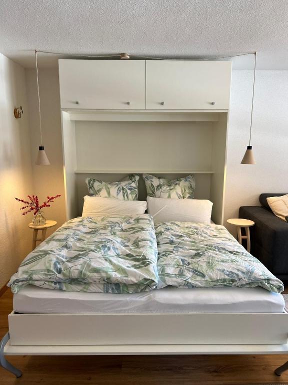 Postel nebo postele na pokoji v ubytování New renovated apartment in center of Davos