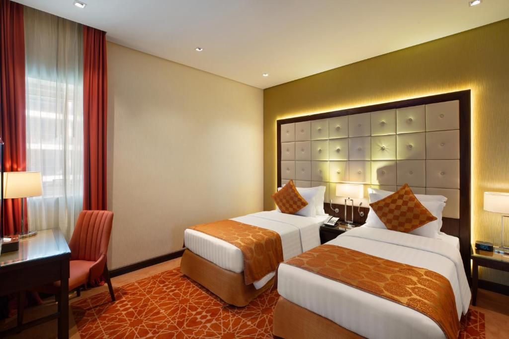 Postel nebo postele na pokoji v ubytování Royal Continental Suites Business Bay - Deluxe Apartments