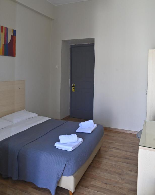 Postel nebo postele na pokoji v ubytování Kentrikon