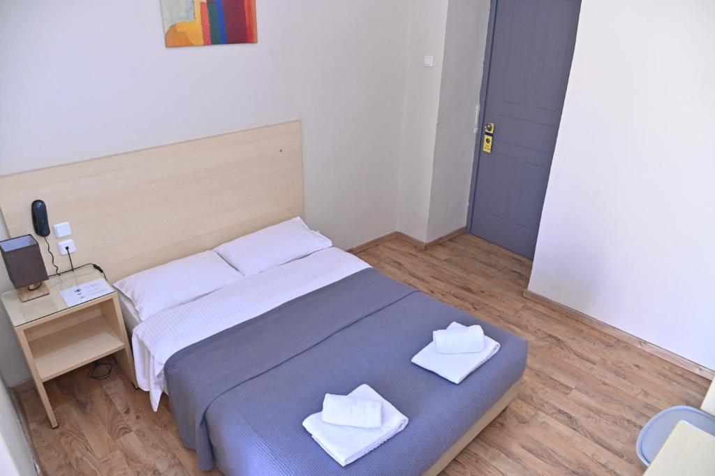 Postel nebo postele na pokoji v ubytování Kentrikon