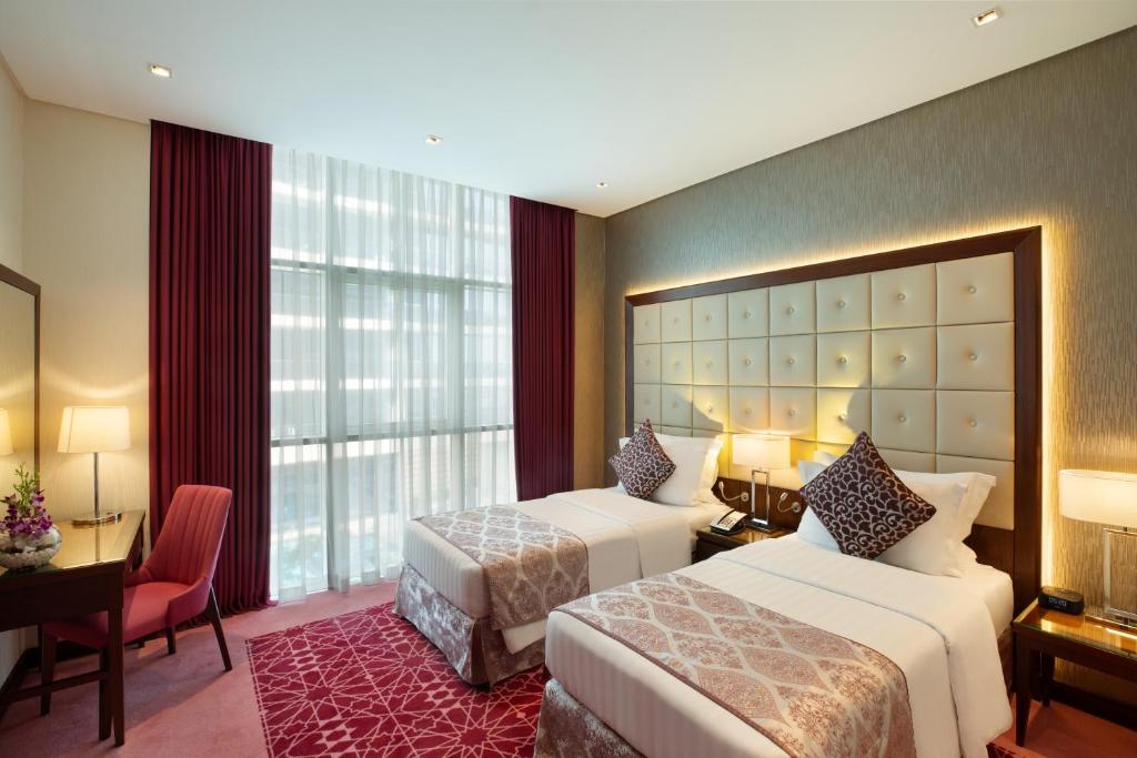 Postel nebo postele na pokoji v ubytování Royal Continental Suites Business Bay - Deluxe Apartments