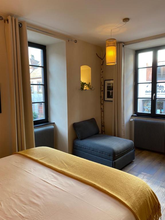 Postel nebo postele na pokoji v ubytování Les Chambres - Au Grès du marché