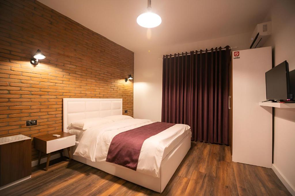 Postel nebo postele na pokoji v ubytování Hotel Sidi