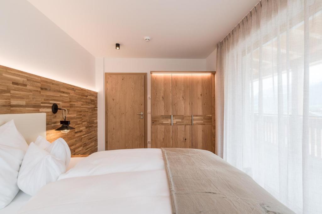 Postel nebo postele na pokoji v ubytování Hotel B&B Feldmessner