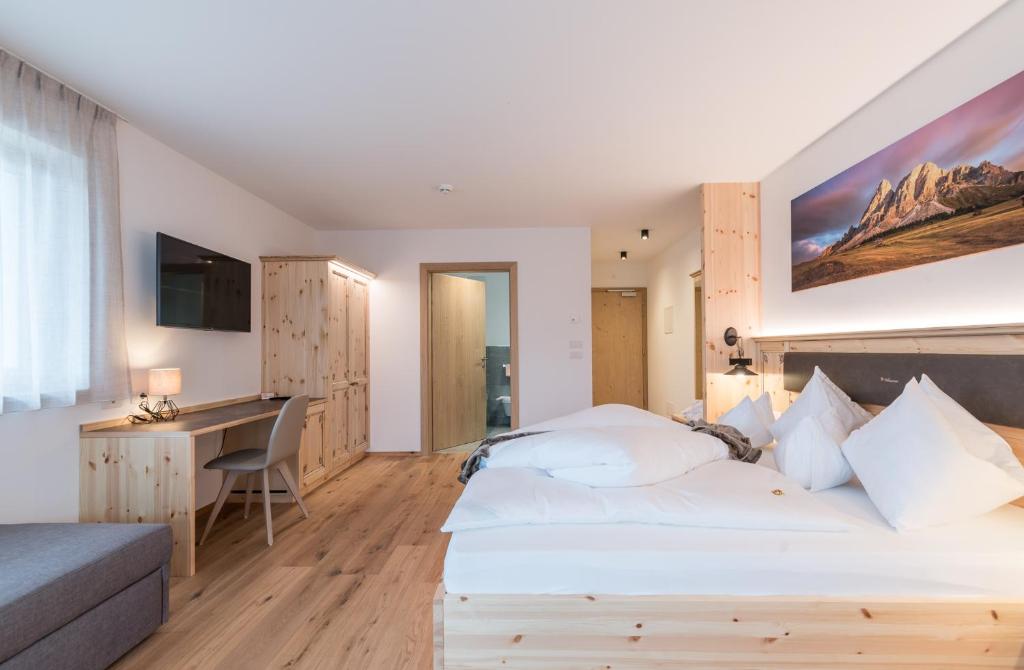 Postel nebo postele na pokoji v ubytování Hotel B&B Feldmessner
