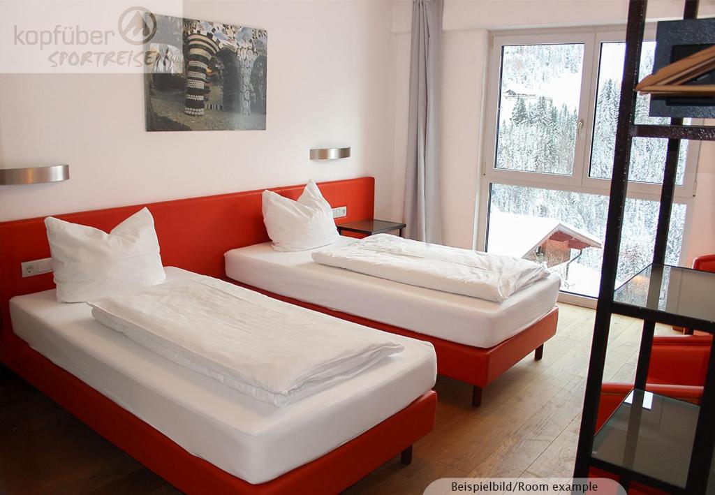 Postel nebo postele na pokoji v ubytování Sporthotel Shanti