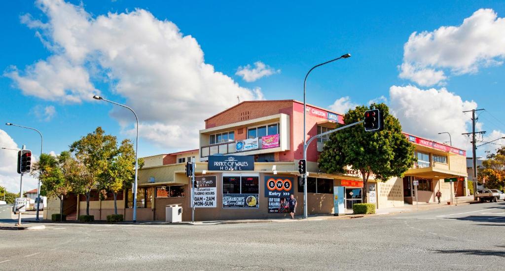 a building on a street corner with a traffic light at Prince of Wales Hotel in Brisbane