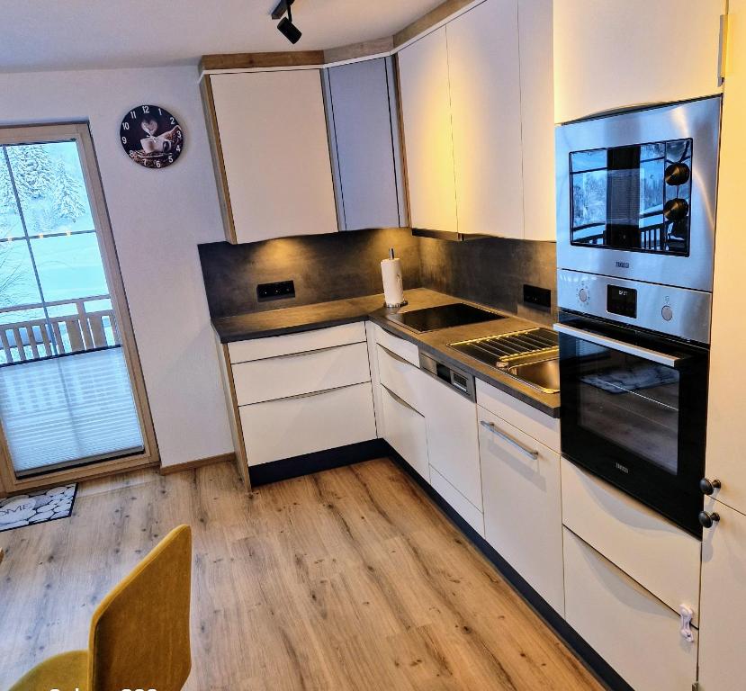 Kuchyň nebo kuchyňský kout v ubytování Lärchenhof