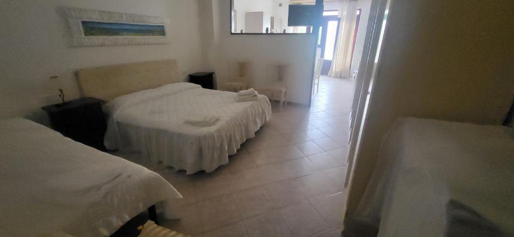 Postel nebo postele na pokoji v ubytování Hotel Dory