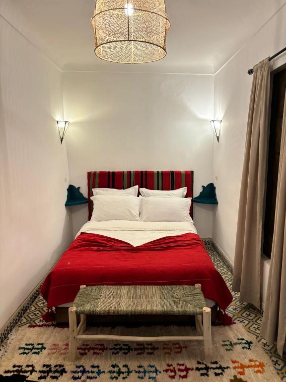 Postel nebo postele na pokoji v ubytování Riad bab Adam