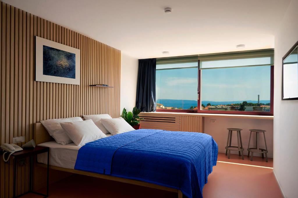 Postel nebo postele na pokoji v ubytování Horizon Luxury Suites & Design Rooms