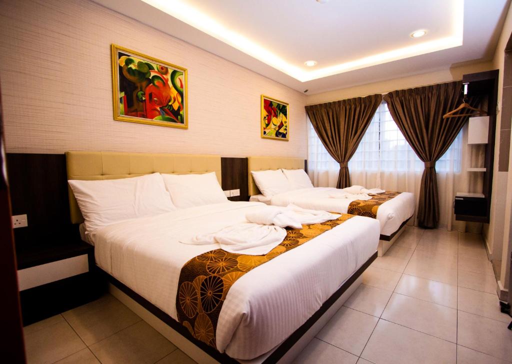 Postel nebo postele na pokoji v ubytování Louis Hotel