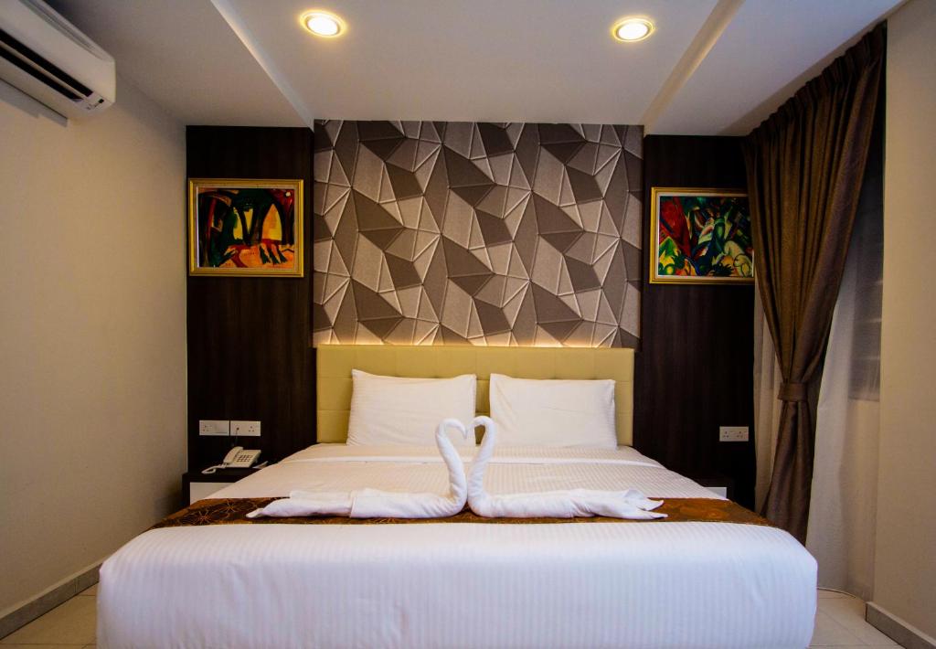 Postel nebo postele na pokoji v ubytování Louis Hotel