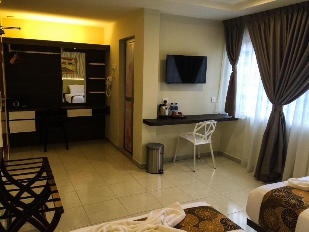 TV a/nebo společenská místnost v ubytování Louis Hotel