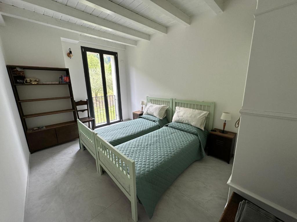 Ένα ή περισσότερα κρεβάτια σε δωμάτιο στο B&B Marco Zona Autodromo IMOLA