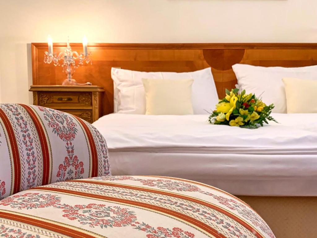 Łóżko lub łóżka w pokoju w obiekcie Hotel Štekl
